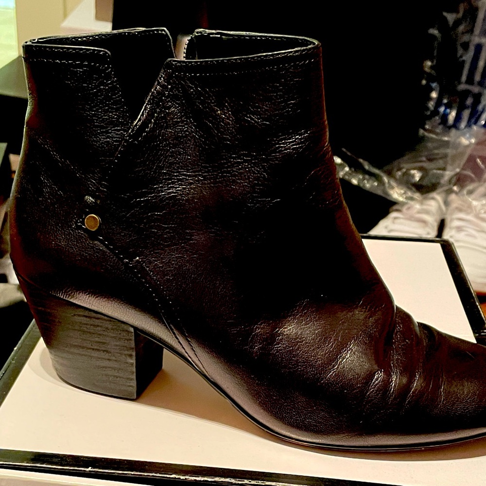 Black booties with zip and vent.